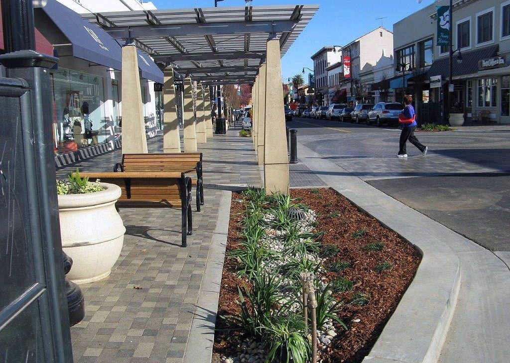Street view of the award-winning Burlingame Avenue streetscape with widened sidewalks, trees, and pedestrian improvements.